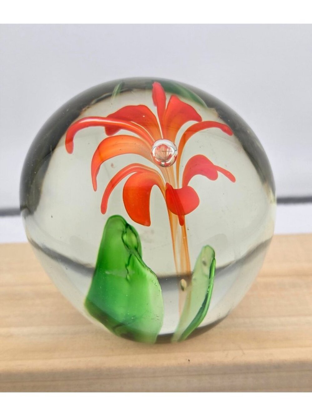 Handcrafted Clear Glass Paperweight With Orange Flower Design & Green Leaves - Picture 3 of 15